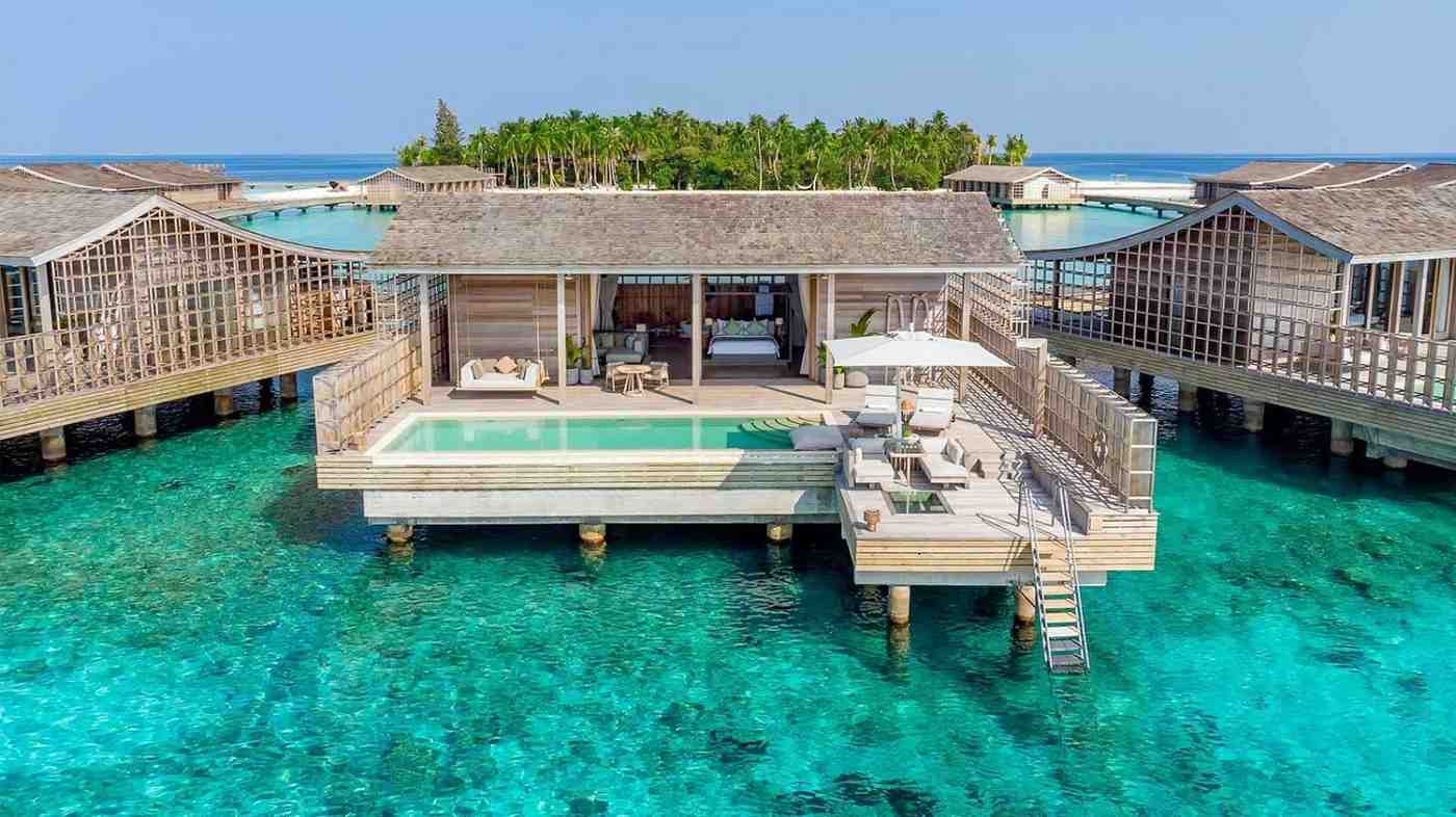 Luxury travel destination with turquoise water and overwater villas